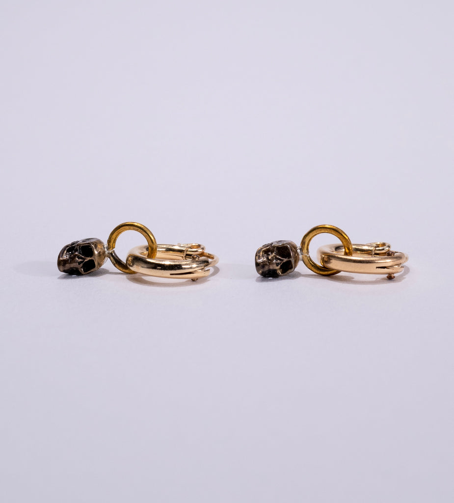 gold skull huggie earrings