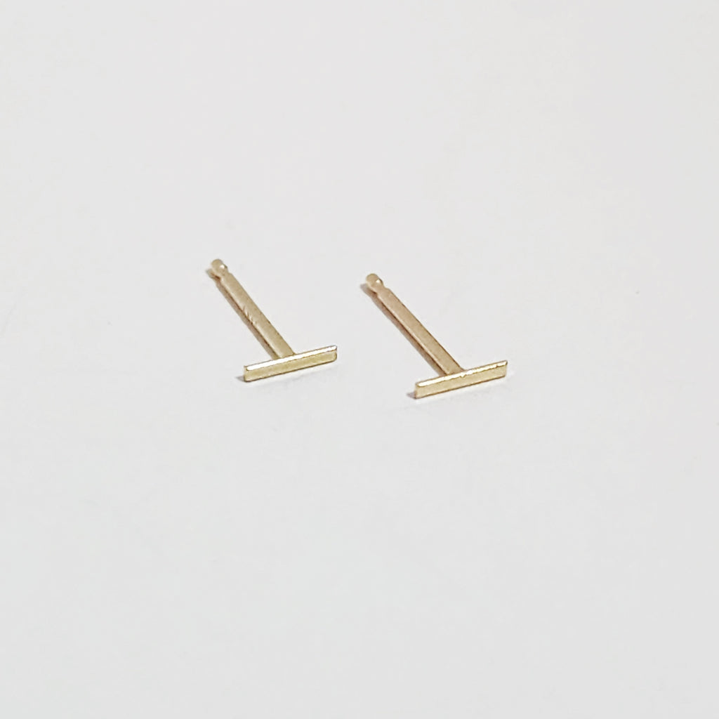 tpin stud earrings in 14 karat gold