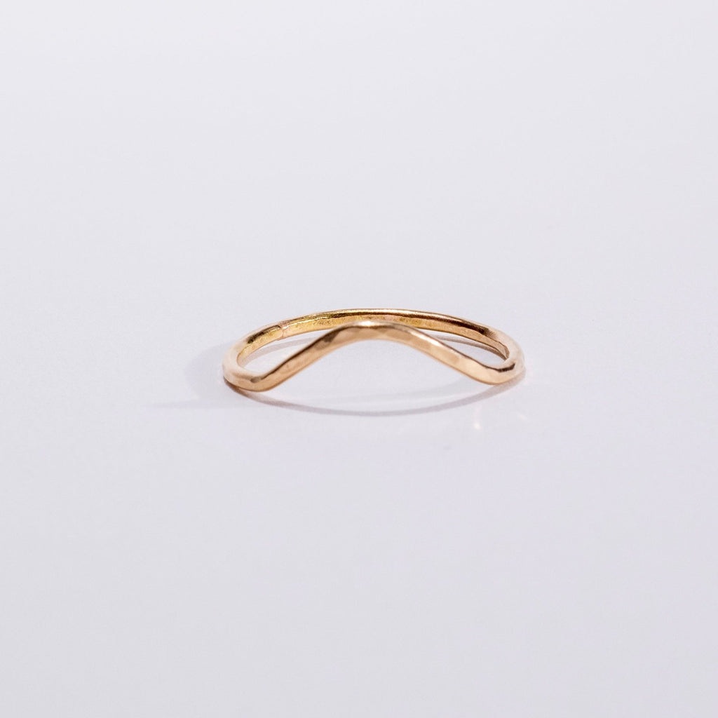 hammered curve stacking ring in 14 karat gold